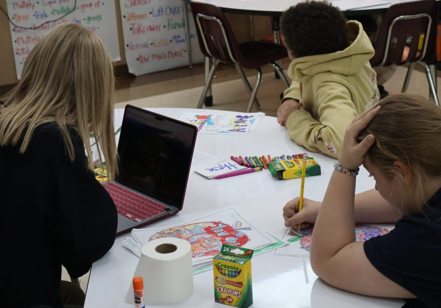 Teacher working with students